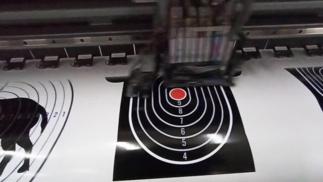 printing on wide format. solvent printer prints picture of target for sticker
