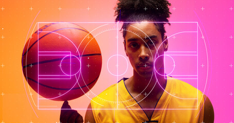Naklejka premium Composite of illuminated basketball court over portrait of serious biracial male player with ball