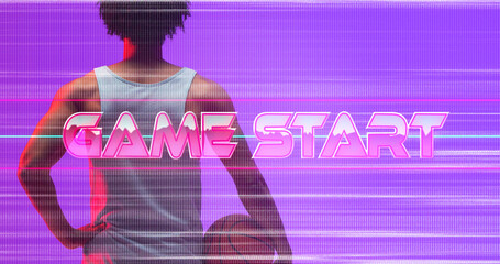 Naklejka premium Composite of game start text with glitch technique over rear view of biracial player with basketball