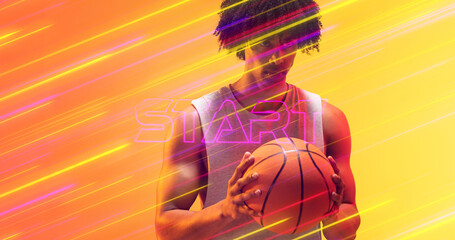 Naklejka premium Composite of start text with illuminated lights over male biracial player holding basketball