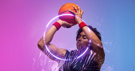 Naklejka premium Composite of biracial basketball player throwing ball by illuminated plants and circle, copy space