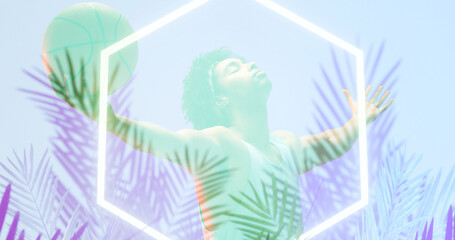 Naklejka premium Biracial basketball player with arms outstretched and eyes closed by illuminated plants and hexagon