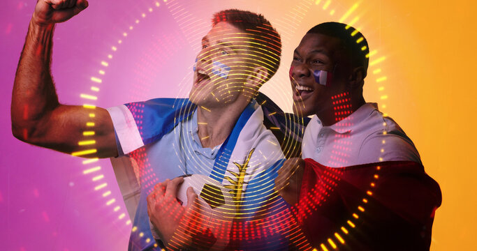 Composite of multiracial male players with french flag screaming over illuminated circles