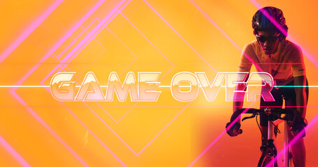 Biracial female athlete wearing helmet and glasses riding bike over game over text and lines