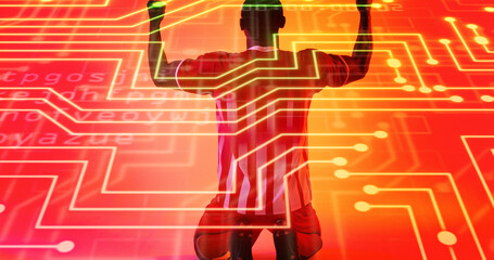 Rear view of african american male player kneeling and raising arms over connected dots and letters - Powered by Adobe