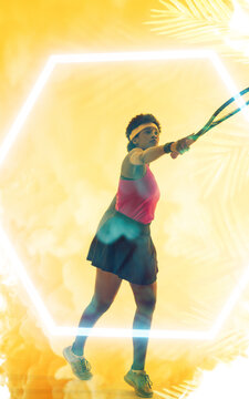 Composite image of determined young african american female athlete playing tennis over leaf pattern