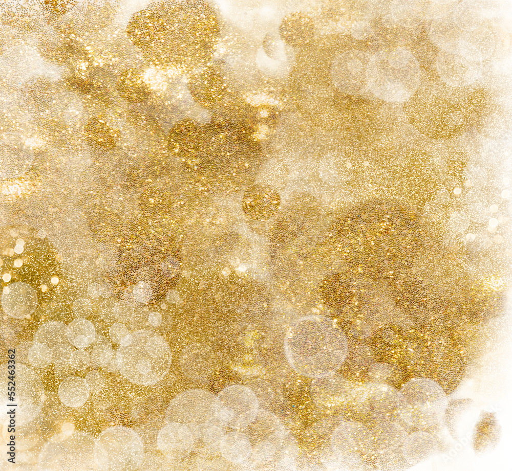 Wall mural golden glittering pattern. festive background of shiny shimmering sparkles