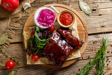 Barbecue pork ribs on wooden table top view