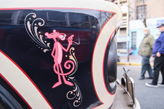 Buenos Aires, Argentina, June 20, 2022: Drawing of the Pink Panther character in fileteado porteño style, intangible heritage of humanity, on the side of a classic Mercedes Benz 911 bus.