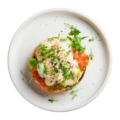 eggs Benedict with salmon and avocado on white plate top view isolated on white background