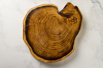 beautiful wooden board on marble table top view
