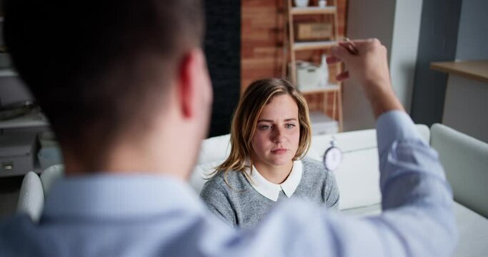 Psychology Hypnosis Using Pendulum. Hypnotic Treatment