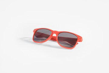 Fototapeta premium Red sunglasses on white background