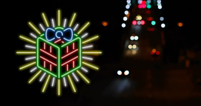 Animation of flickering neon christmas present decoration over road traffic background