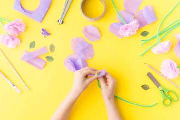 Obraz na płótnie Canvas Easy paper craft with kids flowers. Mother's day. Hands. Happy birthday.