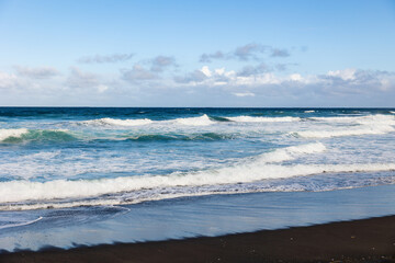 Atlantic ocean, waves and sand, good weather, Azores islands.