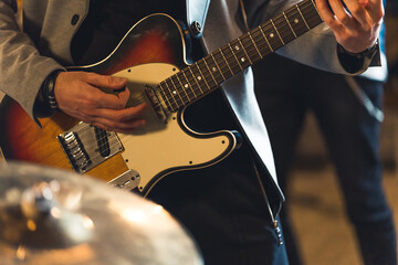 Obraz na płótnie Canvas Close up of man playing electric guitar. High quality photo