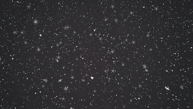 Animation of snow falling over black background at christmas
