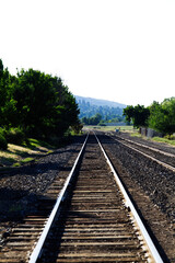 Fototapeta na wymiar Empty Railroad Tracks Leading To Turn