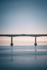 A car driving over the bridge