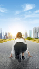 Rear view of Asian businesswoman in start position ready to run