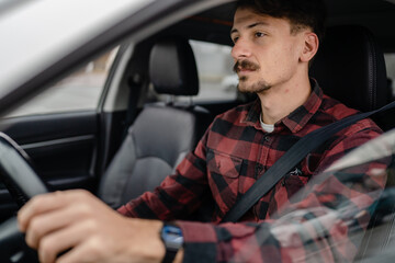 one man drive car adult male sitting on the driver's seat