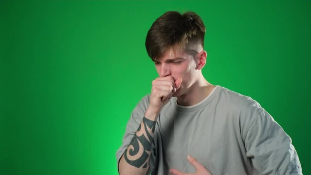 Unhealthy man covering mouth with hand and cough