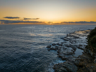 Sunrise over the ocean with rocks