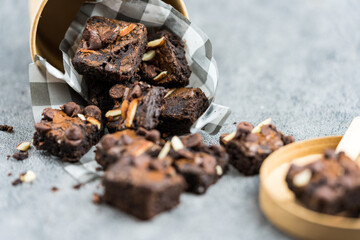Delicious chocolate chips and slice almond brownie, selective focus