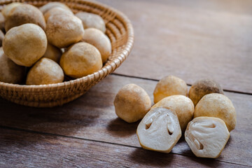 Straw mushroom on wooden table