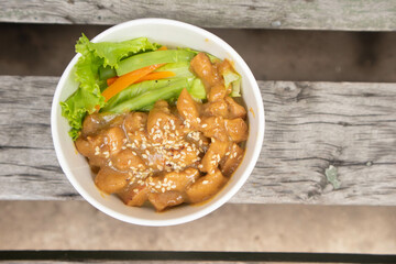 Teriyaki chicken pieces with sesame and greens, Asian style meal - roasted chicken fillet with teriyaki sauce.