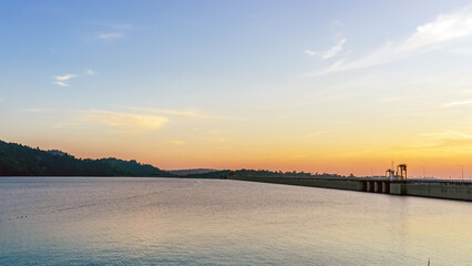 Beautiful and peaceful view of the river flowing through the mountains above Khun Dan Prakan Chon Dam, Nakhon Nayok, Thailand in the evening. Beautiful scenery landscape during sunset. Tourism concept