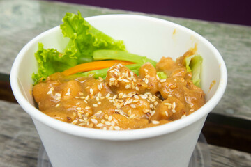 Teriyaki chicken pieces with sesame and greens, Asian style meal - roasted chicken fillet with teriyaki sauce.