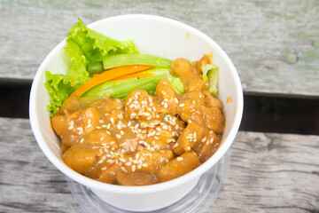 Teriyaki chicken pieces with sesame and greens, Asian style meal - roasted chicken fillet with teriyaki sauce.
