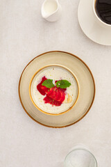 Portion of healthy sweet porridge with banana and jam