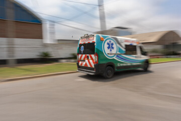 Ambulance in a rush passing at high speed