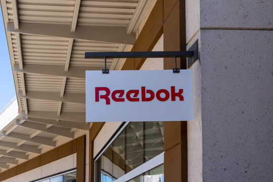 Close up of Reebok store hanging sign is seen on June 27, 2022 in Niagara-on-the-Lake, On, Canada. Reebok International Limited is an American footwear and clothing company. 