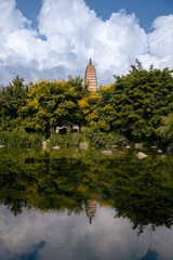 The Three Pagodas of Chongsheng Temple near Dali Old Town, Yunnan province, China. Scenic mountains are visible in background. Ancient pagodas are a popular tourist destination of Asia.