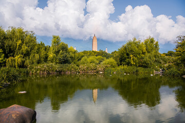Scenic panorama of reflection park pond with the Three Pagodas and Cangshan mountains in background...