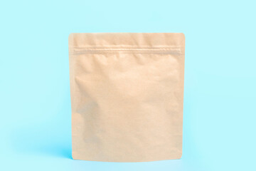 A brown kraft package close-up on blue background.