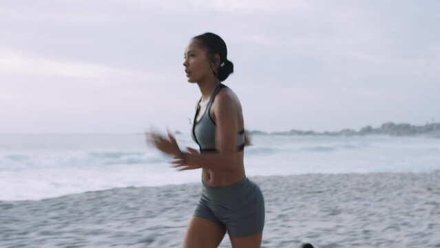 Fitness, motivation or black woman running on beach sand for training, exercise or wellness workout in Brazil. Health, sports or athlete girl runner for marathon, race or sport challenge event