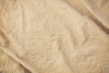 Crumpled brown cotton napkin texture background