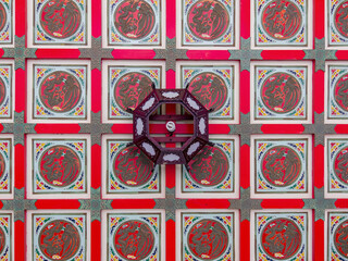 Close up shot of a ceiling with dragon figure