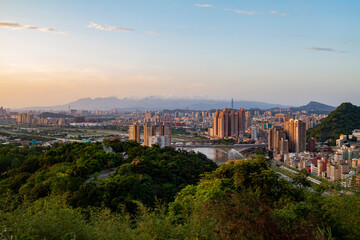 Sunset aerial view of the Xindan District cityscape from Hemei Mountain