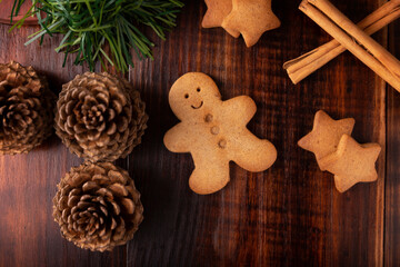 Homemade gingerbread man cookies, traditionally made at Christmas and the holidays. Table top view