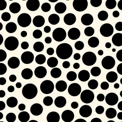 Seamless white background with black polka dots of irregular shapes and sizes.