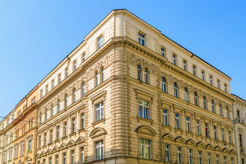 Corner of the house of classical European architecture of the old cozy tourist city. Background with selective focus