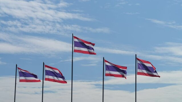 Five Thai flags waving in the blue sky. 4K and 16:9 size video