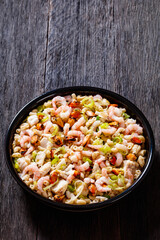 macaroni salad with shrimps, mussels, fish, leek