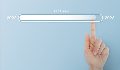 Loading new year 2022 to 2023 with hand point in progress bar. blue background for the holiday.